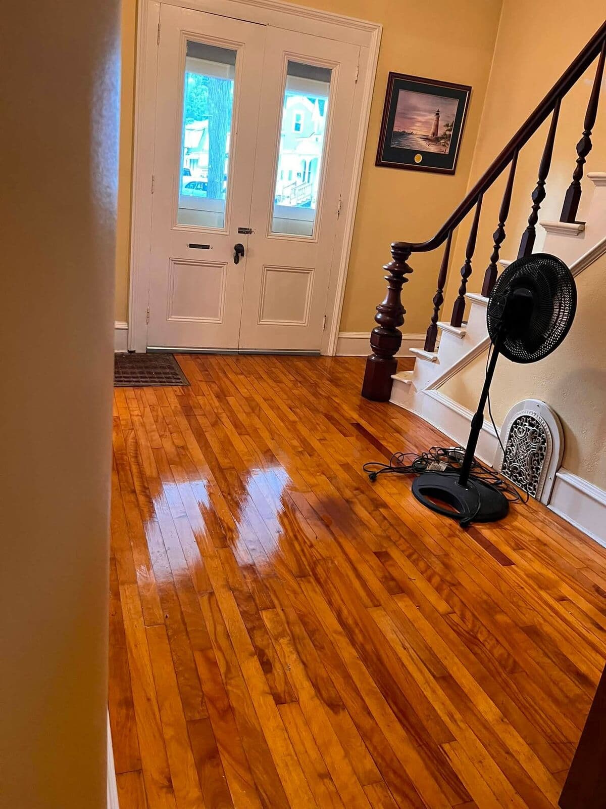 Entryway with gleaming hardwood floors